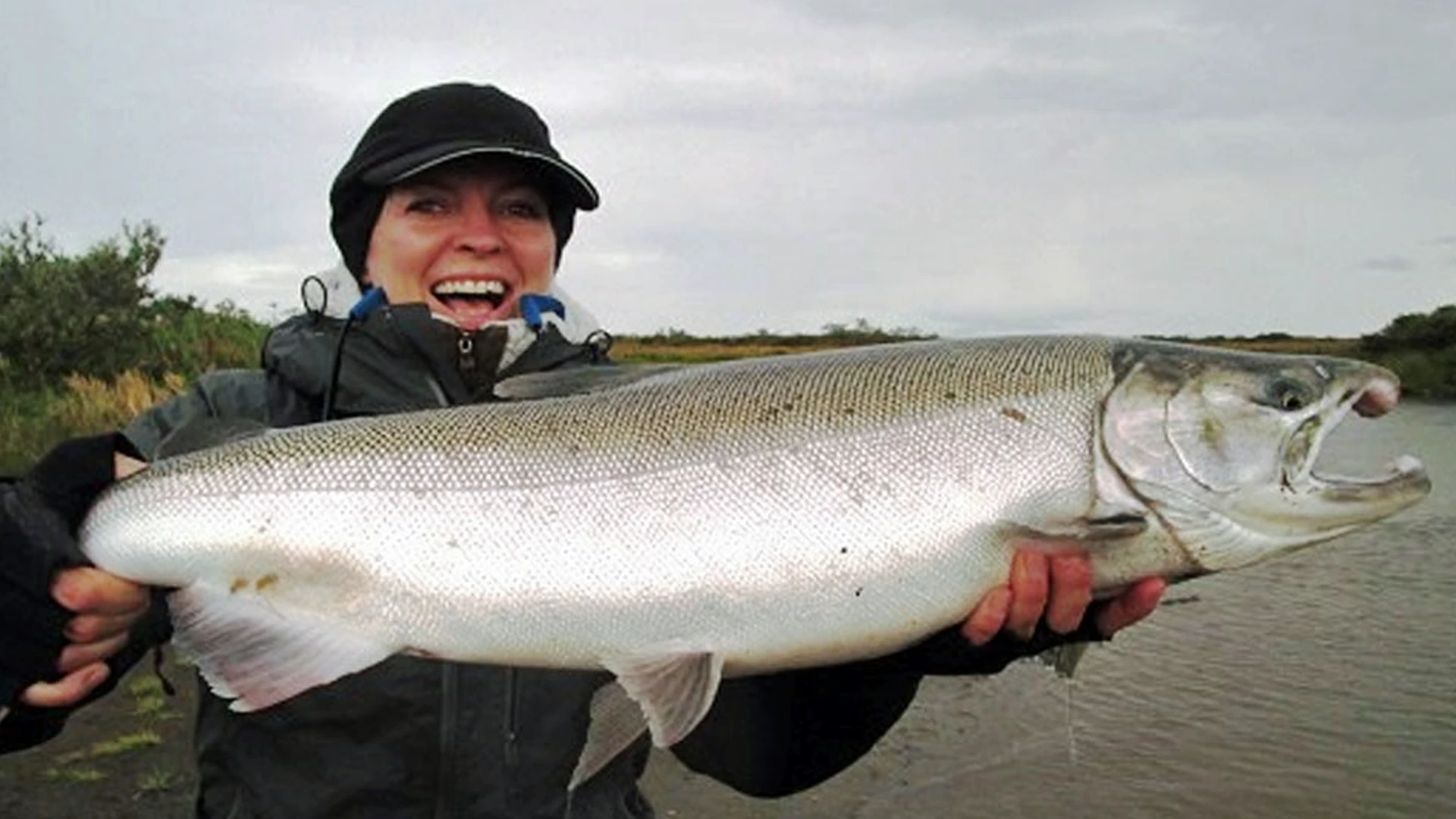 Woman angler with large Sapsuk Silver River salmon on the Alaska Peninsula.