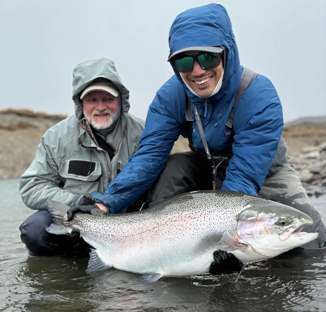 Guy Schoenborn and Guide Guy Schoenborn was able to bring a 21.5-rainbow trout to the net during a hosted week at Jurassic Lake Lodge in Argentina.