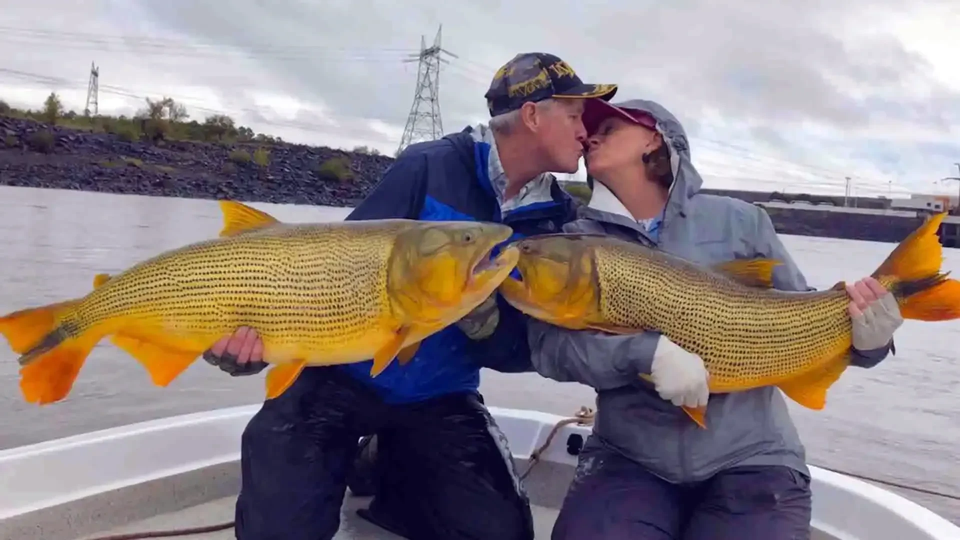 Jim and Cindy Jim and Cindy Schmid with a Golden Dorado double while fishing at La Zona Lodge in Argentina.