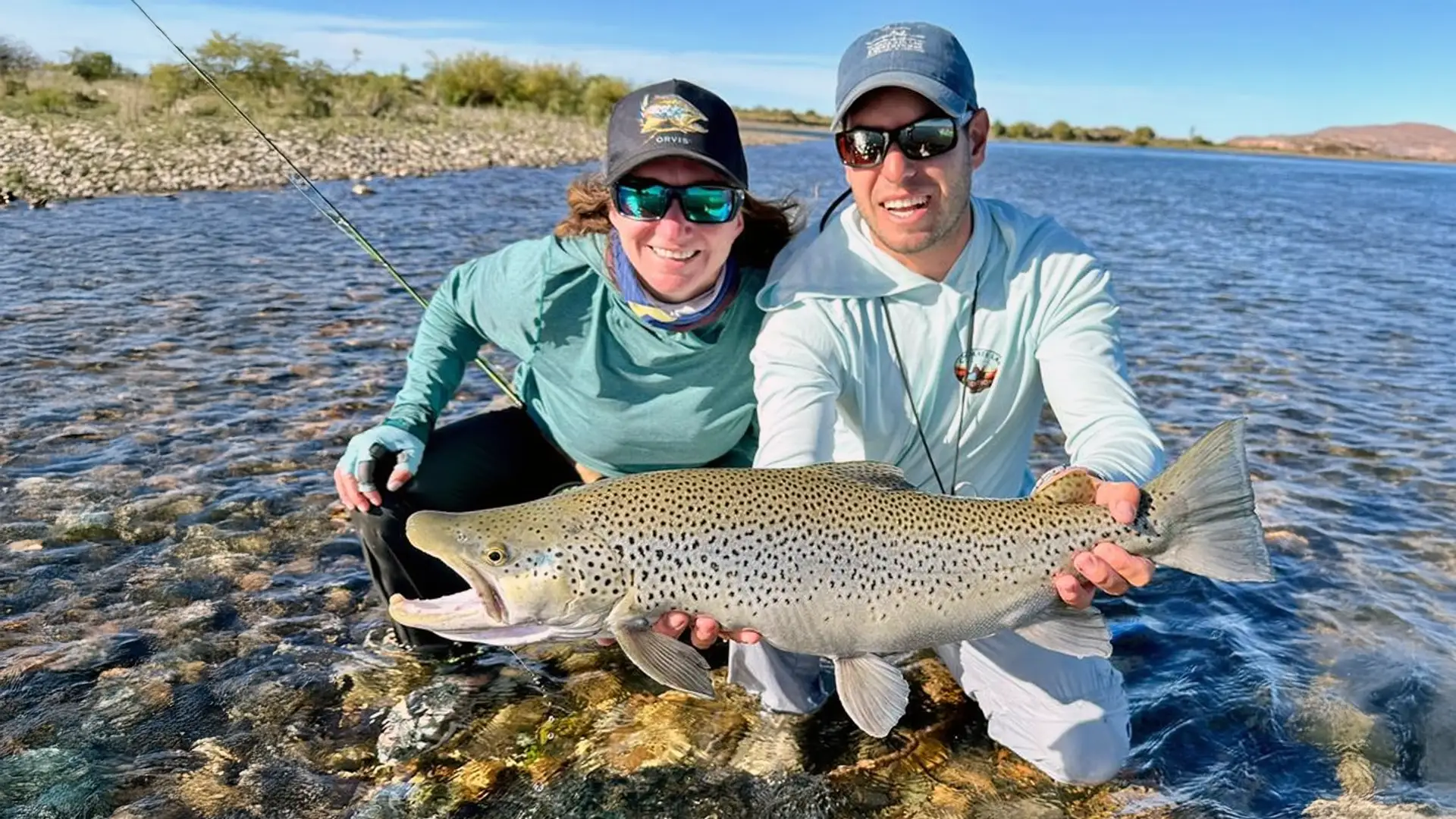 Angler and guide with a large Limay River Brown Trout - Chocolate Lab Expeditions.