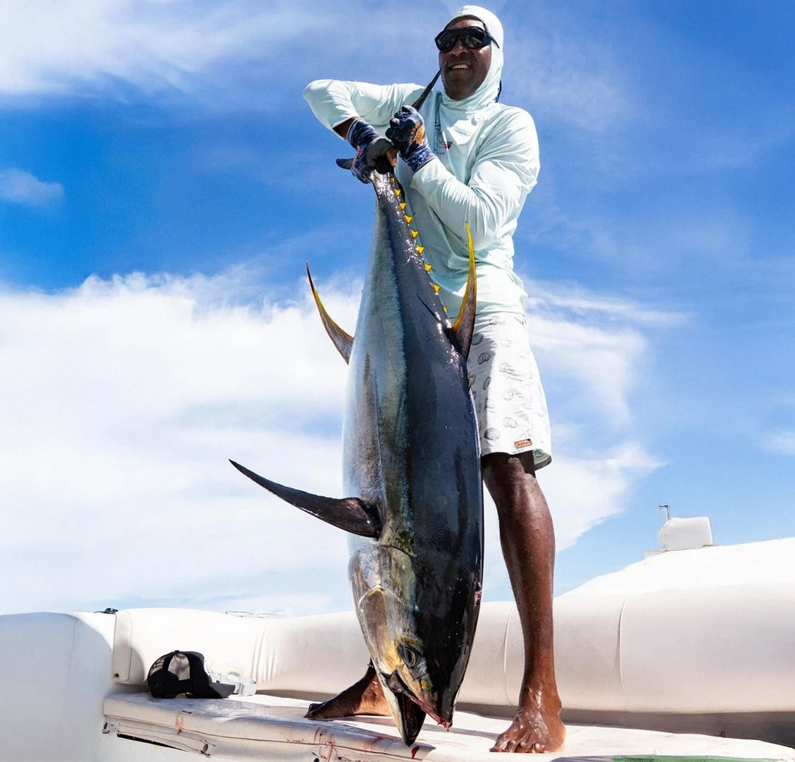 Captain with a Yellowfin Tuna Captain Edwin with a 150 lbs± yellowfin tuna during a Fishing with Larry 2026 hosted fishing week.