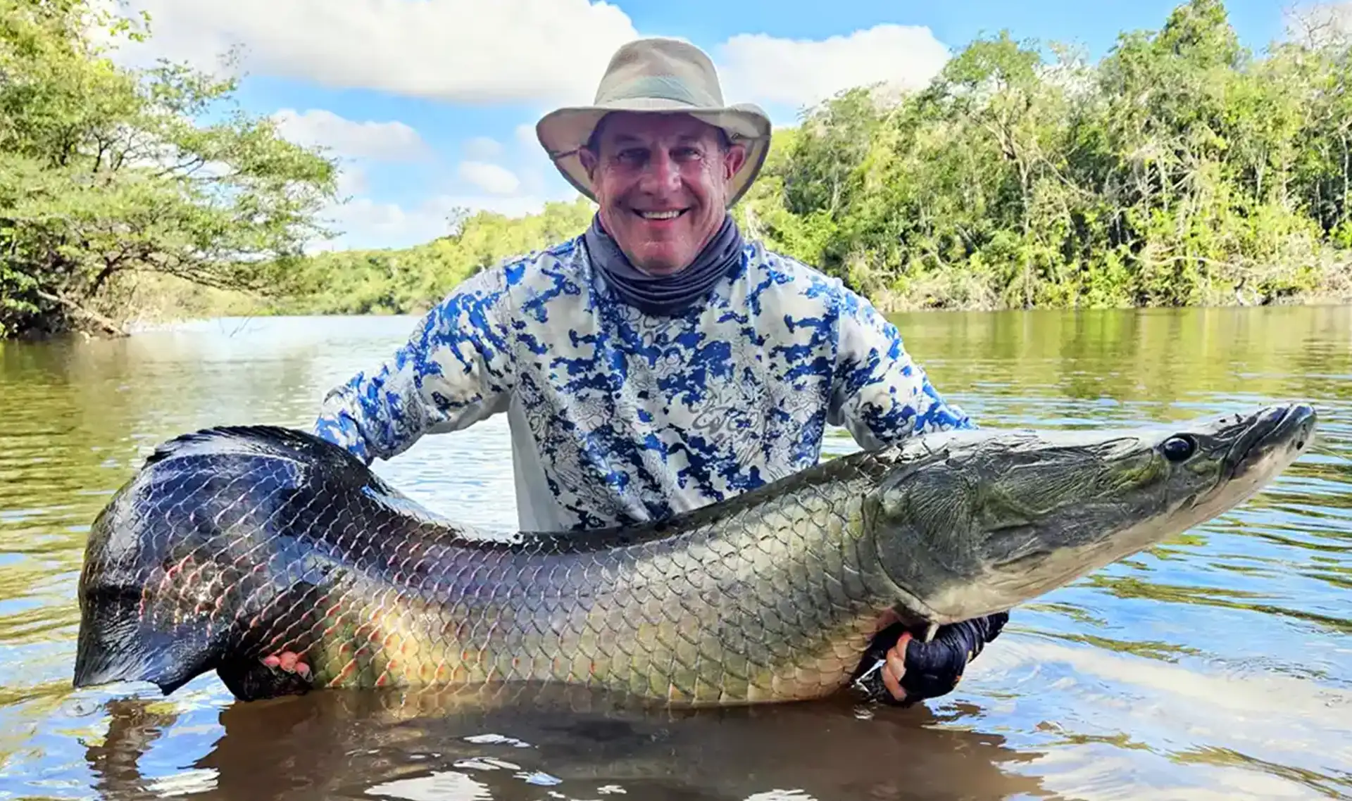 Dave Erickson with a large arapaima during our Fishing with Larry 2025 Hosted Week.