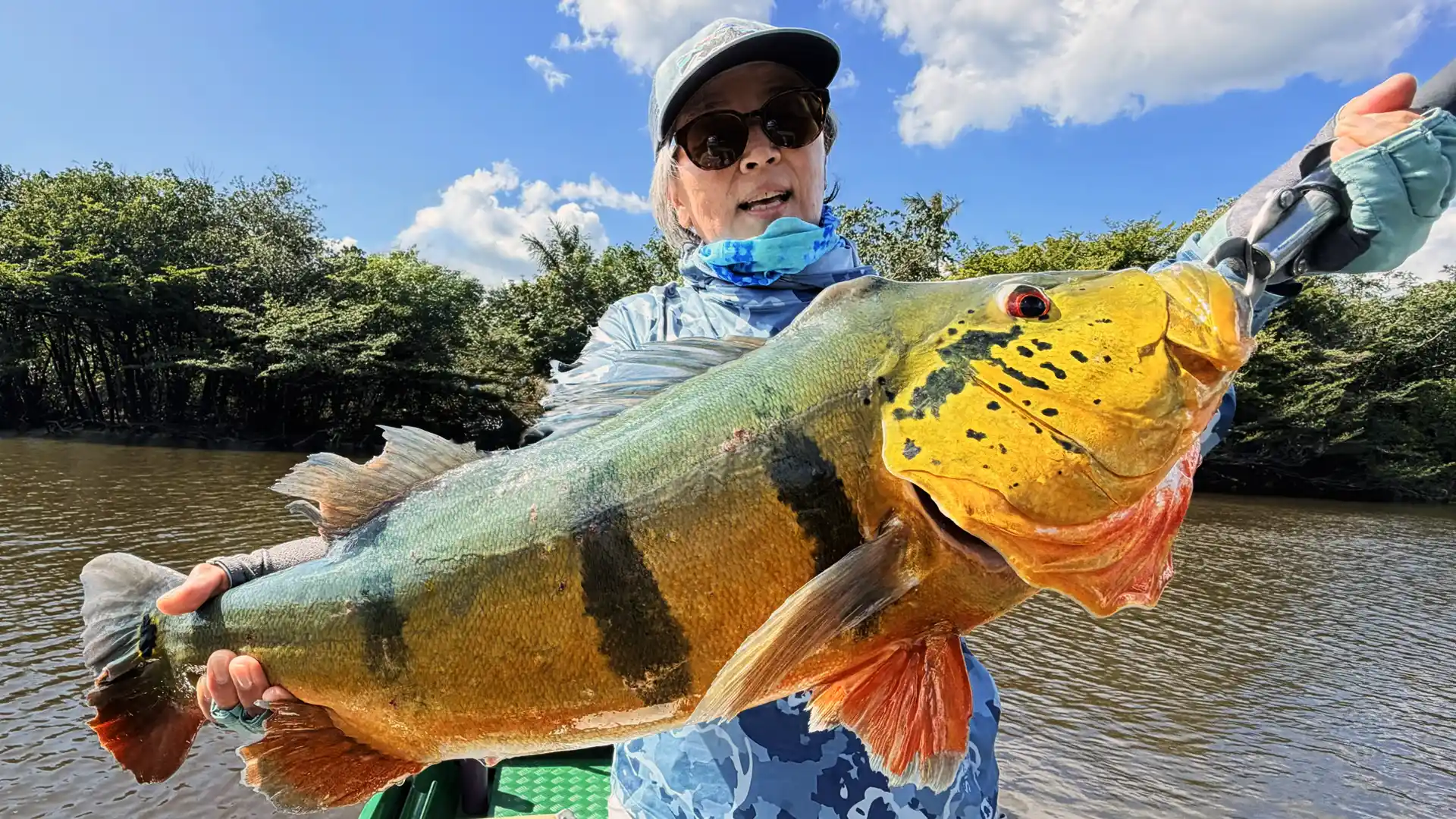 Kathy Kim with an Agua Boa Peacock Bass during our Fishing with Larry 2025 Hosted Week.